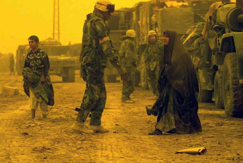 An Afghan woman is taking in distress with the US Marine